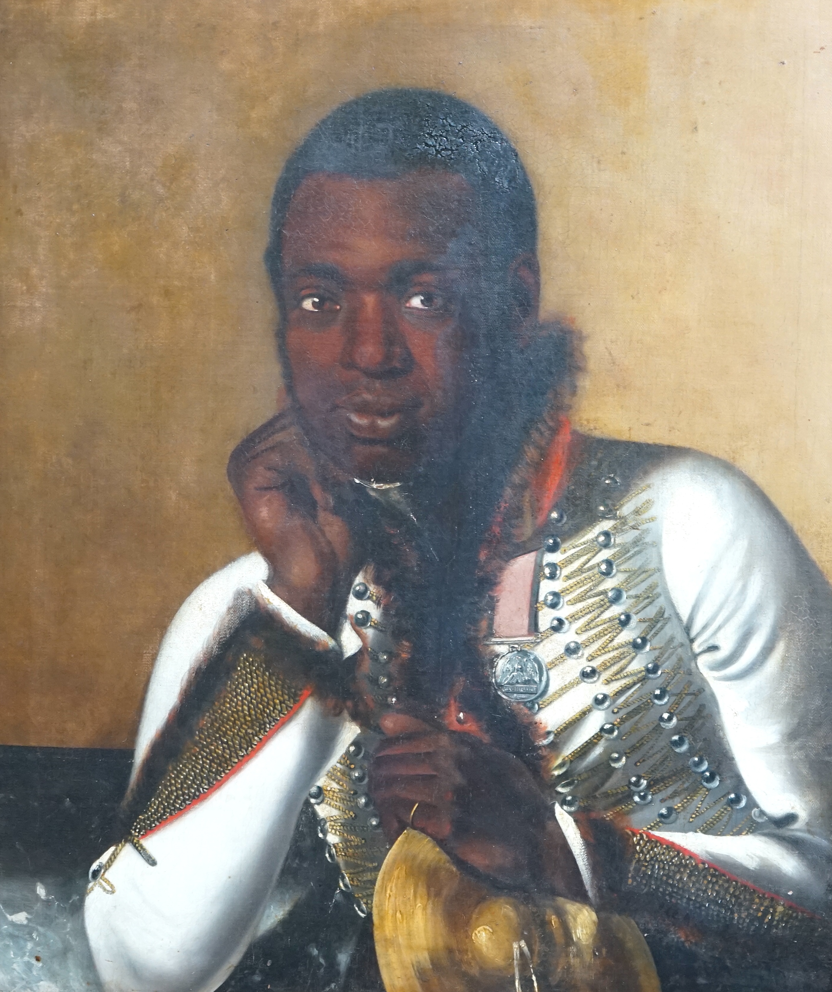 Early 19th century English School , Portrait of a black bandsman in uniform wearing the Waterloo medal and holding a cymbal, oil on canvas, 74 x 62cm